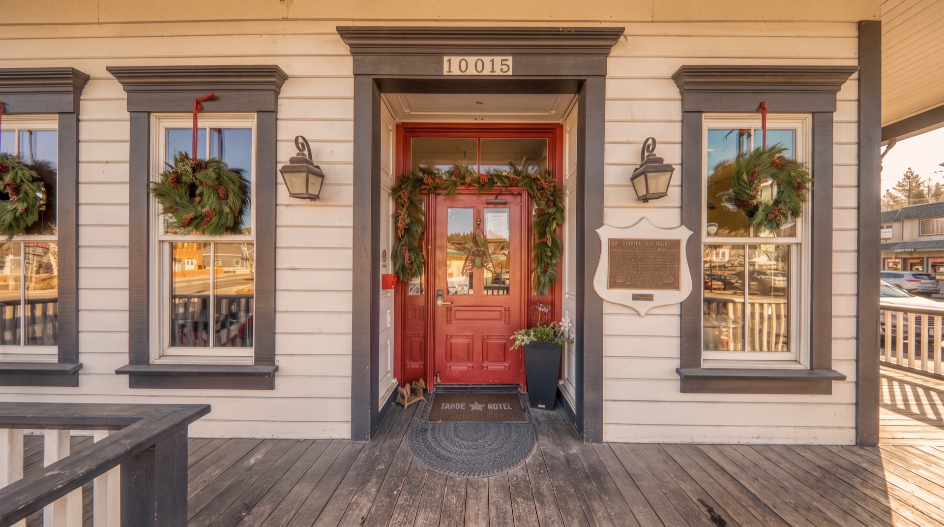 The red front door with historic plaque